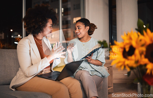 Image of Business, planning and women with laptop, notebook and creative idea, project or working at night together with research. Teamwork, conversation and collaboration in Atlanta office or workplace