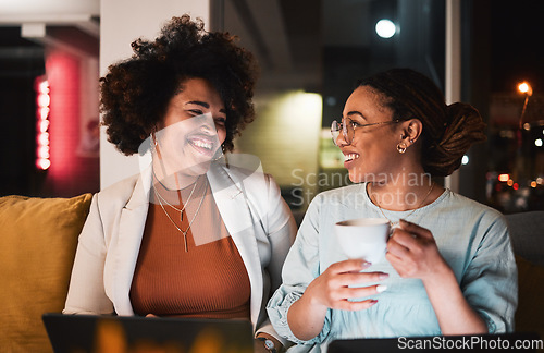 Image of Women, happy and talking at night for teamwork, collaboration and working late in office. Communication, deadline and entrepreneur people or friends with laptop and coffee while brainstorming ideas