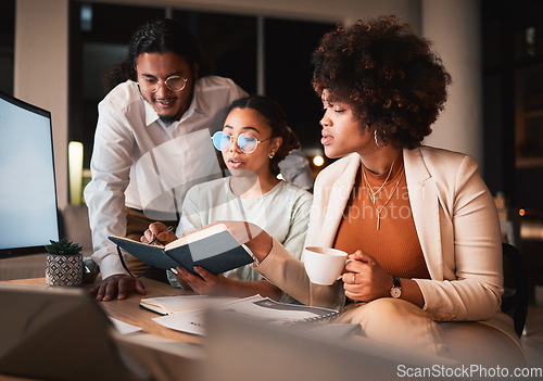 Image of Notebook, discussion and business people in office at night for teamwork creative project. Reading, conversation and professional designers working overtime in collaboration for research in workplace