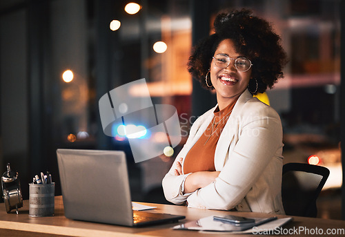 Image of Business woman, portrait and arms crossed on computer for night planning, marketing research and online management. Professional african person or happy editor on laptop with career mindset and bokeh