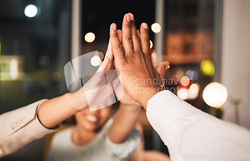 Image of Success, closeup and business people with a high five at night for motivation or team building. Happy, dark and employees with a gesture in an office for goals, target or achievement on a deadline