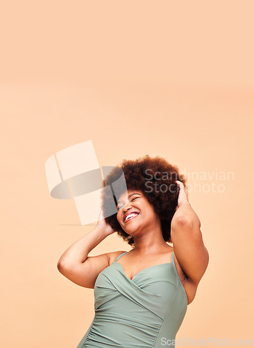 Image of Black woman, swimwear and self love, smile and confident with body positivity in studio on peach background mockup space. Happy, person and girl in natural beauty and face for freedom in swimsuit