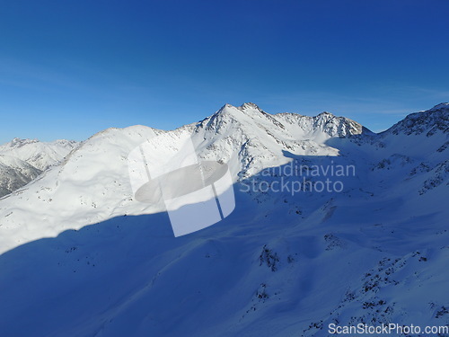 Image of Mountain, snow and sky on the Swiss Alps for travel, holiday or vacation with a view of nature. Environment, landscape and adventure in a remote location in cold weather season of winter in Europe