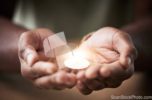 Image of Prayer, candle or hands of man for worship, faith and belief for support, help and hope in Christian religion. Light, closeup or person in meditation for spiritual healing, mercy or trust for praise