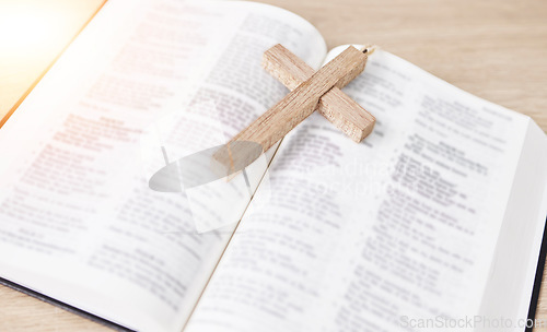 Image of Bible, cross and religion, Christian and worship, faith and God with studying scripture closeup. Jesus Christ, prayer and spiritual, holy book and praise with crucifix for healing and gospel