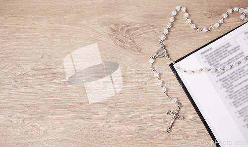 Image of Bible, cross and religion, Christian and God with worship, studying scripture and rosary beads. Jesus Christ, prayer and spiritual, holy book and praise with top view, gospel and mockup space