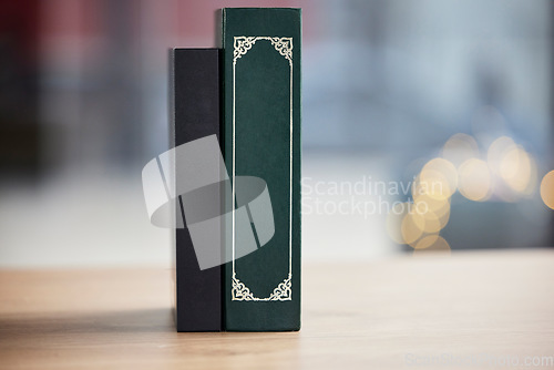 Image of Books on table, mockup space and bokeh for religion, reading and study in faith education. Holy bible, desk and spiritual for learning, gospel knowledge and information to worship on a background