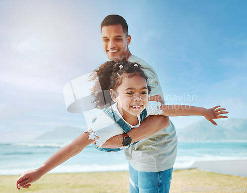 Image of Dad, playing and girl as a plane on beach for fun game on vacation, holiday or freedom to travel to the ocean in Miami. Child, flying and dad with kid to support, play and bonding together in summer