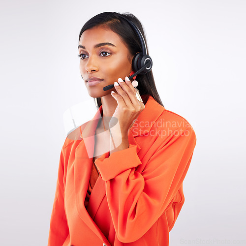 Image of Call center, listening and woman telemarketing, support and help in studio isolated on a white background. Contact us, customer service agent and sales consultant on microphone for thinking of crm