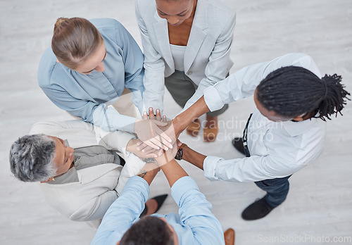 Image of Hands stack, group circle and business people celebrate community cooperation, synergy or corporate meeting. Top view, project collaboration or staff partnership, solidarity and team building support
