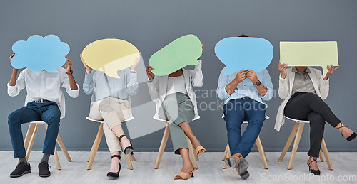 Image of Social media, speech bubble and business people with a sign for opinion in a waiting room for an hr interview. Marketing, advertising or communication with men and woman in the office for recruitment