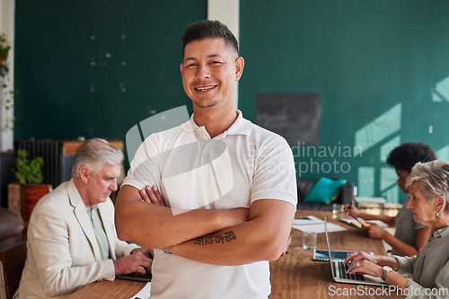 Image of Smile, portrait and a man in a meeting with arms crossed for coworking and business pride. Happy, office and a mature businessman with confidence in professional team and career in the workplace