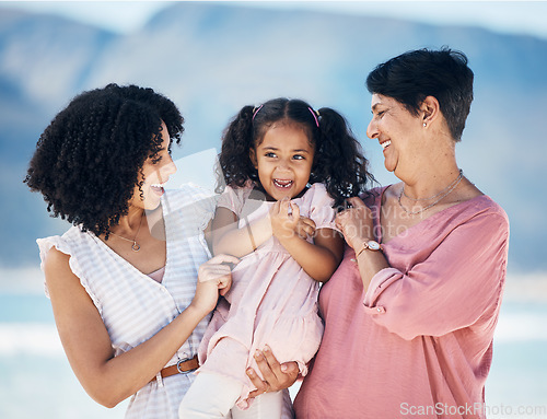 Image of Happy family, hug and girl with mother and grandmother at the beach with freedom, fun and bond in nature. Love, smile and child with mom and grandma at sea for travel, vacation or ocean trip in Miami