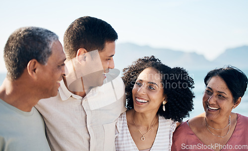 Image of Beach, senior parents and adult children together with smile, love and hug on summer holiday in Mexico. Embrace, happy family support and mature mom, dad and woman on ocean vacation travel in nature.