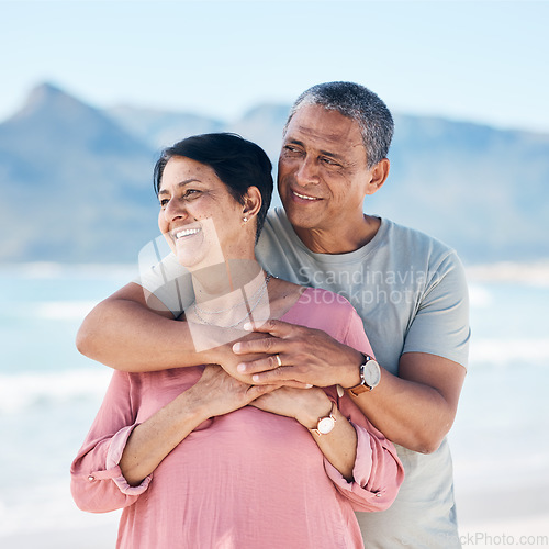 Image of Love, hug and mature couple outdoor with a smile, care and happiness together in nature. A happy man and woman for healthy marriage, commitment and freedom on travel, beach holiday or vacation