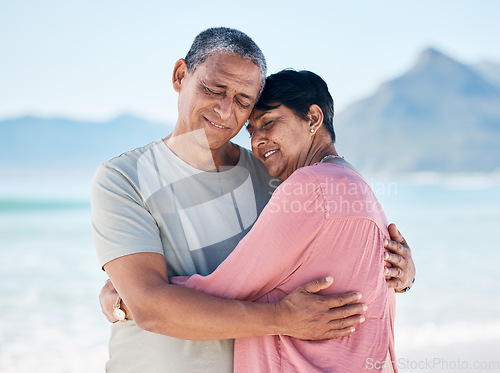 Image of Mature couple, love and hug outdoor at beach with a smile, care and happiness together in nature. A happy man and woman for healthy marriage, commitment and freedom on travel, holiday or vacation