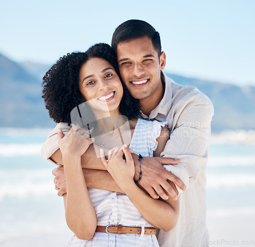 Image of Happy, couple and portrait on beach in Brazil for holiday, vacation or travel for summer break at the ocean, waves or sea. People, smile and hug on tropical adventure together for marriage or love