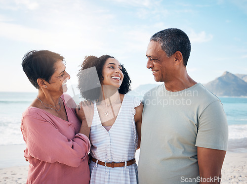 Image of Ocean, senior parents and woman together with smile, love and hug on summer holiday in Mexico. Embrace, happy family support and mature mom, dad and adult daughter on beach holiday travel in nature.