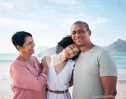 Image of Beach, senior couple and adult daughter hug together with smile, love and blue sky on summer holiday in Mexico. Embrace, happy family and mature mom, dad and woman on ocean holiday travel in nature.