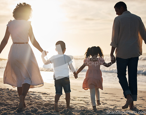 Image of Sunset, beach and back of family holding hands in nature for travel, bond and fun together. Rear view, love and children with parents at the ocean for sunrise walk, relax and enjoy freedom in Mexico