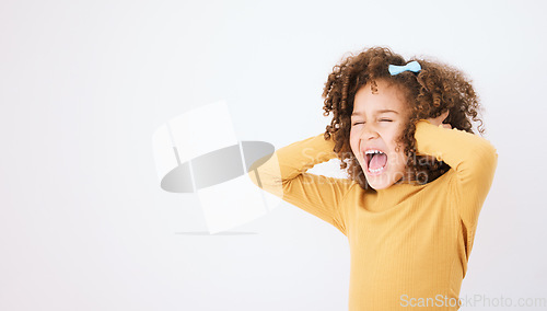 Image of Screaming, loud and mockup with a girl child in studio on a white background covering her ears. Children, sound and audio with a young kid shouting or yelling on empty space for ADHD or autism