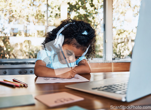 Image of Online learning, headphones and child writing assessment at desk for creative education and development. Audio tech, study and kid with laptop for elearning, virtual help and reading growth at home