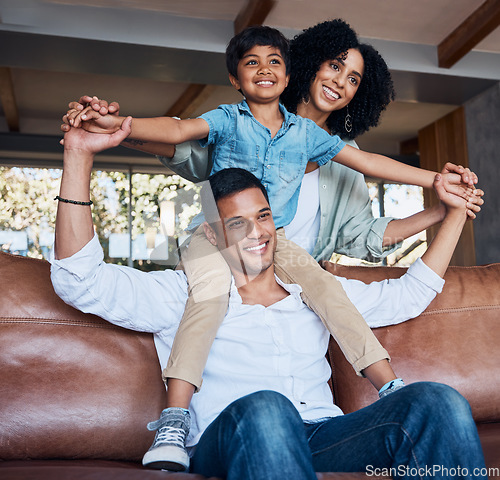 Image of Smile, airplane and relax with family on sofa for happy, bonding or peace on holiday. Love, care and playful with parents and child in living room at home for vacation, hug and fun together