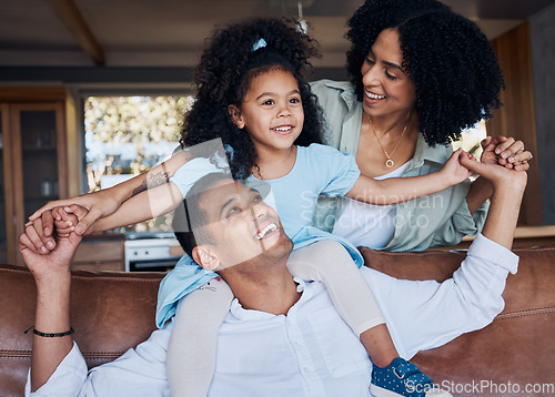 Image of Family, parents and child, happiness and bonding with girl on dad shoulders at home, love and trust with care. Smile, piggyback and mother, father and kid relax on couch, positivity and childhood