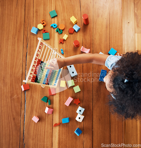 Image of Above, child and toys for math on the floor, home education and fun activity. House, young and a girl kid with blocks and abacus for recreation, counting or perspective on the ground in childhood