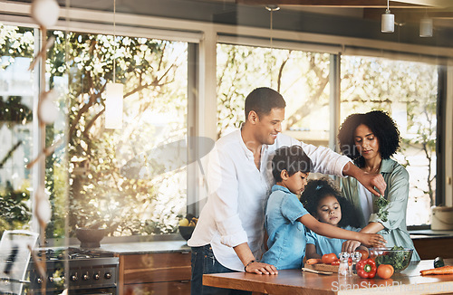 Image of Parents, kids and cooking with vegetables, kitchen and helping hand for learning, nutrition and food in home. Father, mother and children with vegan meal prep, teaching and health in family house