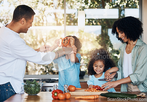 Image of Cooking, health and funny with family in kitchen for learning, food and nutrition. Wellness, support and vegetable with parents and children at home for meal prep, support and dinner together