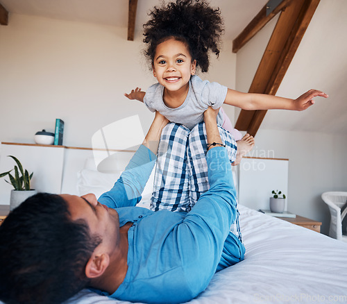 Image of Portrait, airplane and smile of girl child with father in bedroom flying for fantasy, happiness, and fun in modern apartment. Face, love and man lifting young kid on knee in family home for play