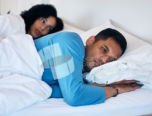 Image of Frustrated couple, fight and lying in bed breakup, divorce or argument from disagreement or dispute at home. Upset woman and man in conflict, cheating affair or toxic relationship in bedroom at house