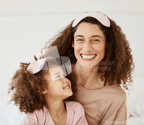 Image of Mom, daughter and sleep mask, happiness and bonding with toddler, love and care in the morning. Woman, young girl and smile at home with pajamas and family, positivity and fun together in bedroom