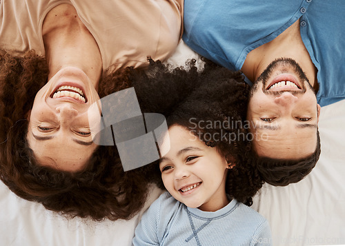 Image of Bedroom top view, child and parents laugh, connect and enjoy quality time together, rest or funny joke, humour or comedy. Home bed, morning closeup and face of happy family kid, mom and dad wellness