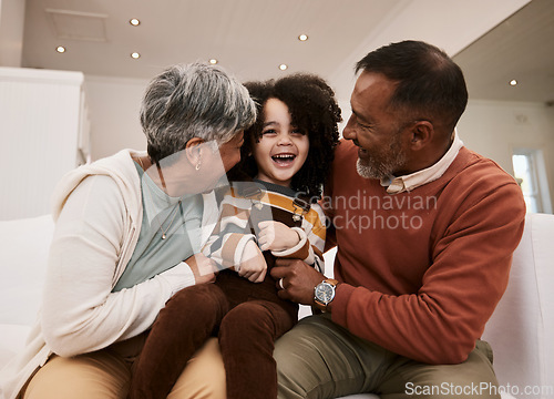 Image of Grandparents love, laugh and happy family child, grandma and grandfather excited, having home fun and babysitting grandchild. Comedy humour, grandfather and grandmother play with kid on lounge sofa