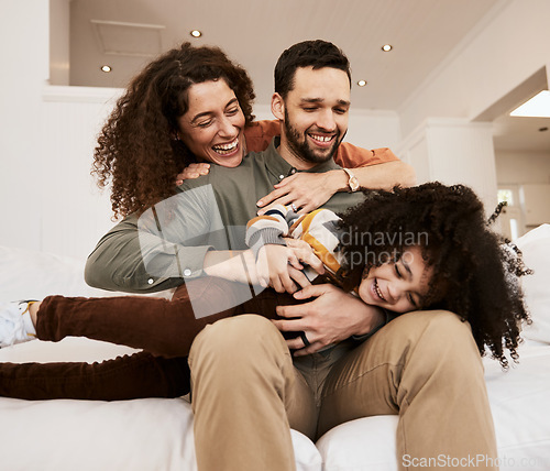 Image of Laughing, play and home child, mother and father having. fun, care and parents tickle young kid, relax and excited on apartment sofa. Funny comedy, love and bonding mama, papa or goofy family bonding