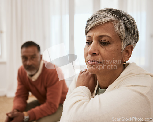 Image of Senior, frustrated and couple in fight, divorce or argument in conflict, dispute or disagreement on sofa. Mature man and woman in toxic relationship, marriage or breakup from cheating affair at home