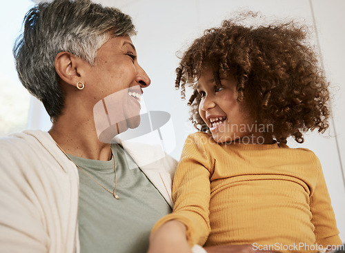 Image of Grandmother, kid and funny laugh in home, bonding for connection and having fun playing together. Grandma, happy and smile of girl child, support and care for love in living room of interracial house