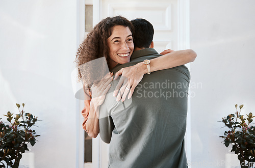 Image of Smile, love and a couple hugging in their home for support, care or romance in marriage together. Happy, trust and security with a woman embracing her husband in their house for relationship bonding