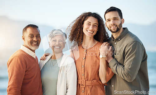 Image of Couple, portrait and mature parents at beach on holiday, vacation or travel. Face, family men and women at ocean for interracial connection, bonding and having fun together, smile and happy at sunset