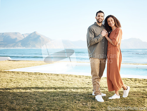 Image of Couple, outdoor pool and portrait with love, garden and happy from travel by the ocean. Smile, hug and gratitude from a woman and man together with care on vacation and relax at new holiday home