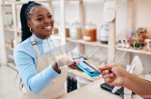 Image of Sustainable shop, cashier and credit card tap with store, woman and electronic transaction with small business. Worker smile, entrepreneur and happy African person with retail employee and shopping