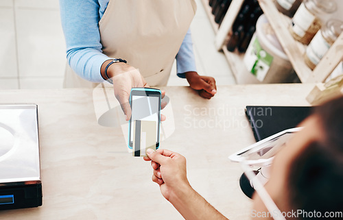 Image of Credit card, store payment and above hand with cashier, machine and transaction in a retail shop. People, ecommerce and shopping with electronic pay, fintech and customer with purchase and tech