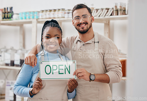 Image of Open sign, partnership and team in small business or grocery store happy for service in a retail shop with board. Smile, management and portrait of entrepreneur ready for operations with billboard