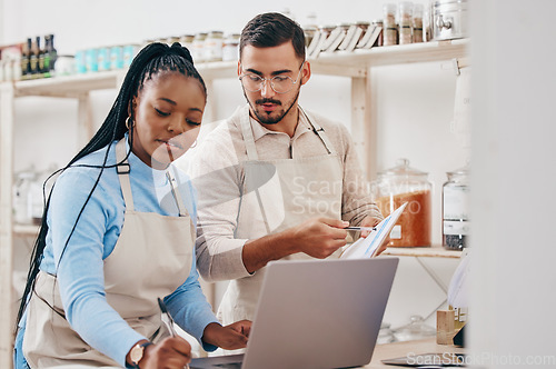 Image of Grocery store, staff and inventory checklist with laptop at a sustainable small business. Workers, stock information and retail management planning in eco friendly and fair trade shop with employees