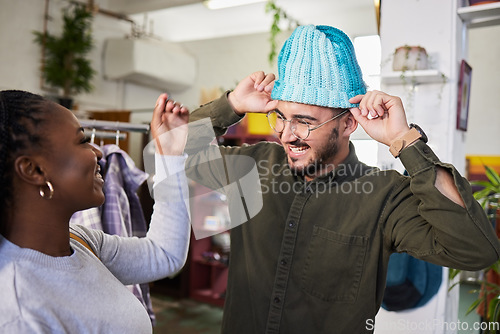 Image of Shopping, couple and a man with a hat for fashion at a retail store with clothes or sale. A man and woman together in a shop or a happy customer with product choice in a boutique or mall with a smile