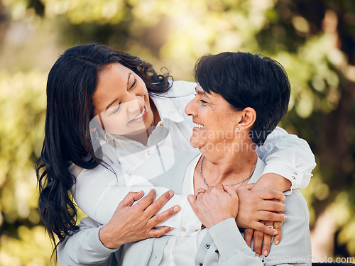 Image of Daughter, mature woman and hug in garden with love on mothers day or women bonding with care for mom in retirement. Happy, family and embrace in outdoor, backyard or together on holiday or vacation