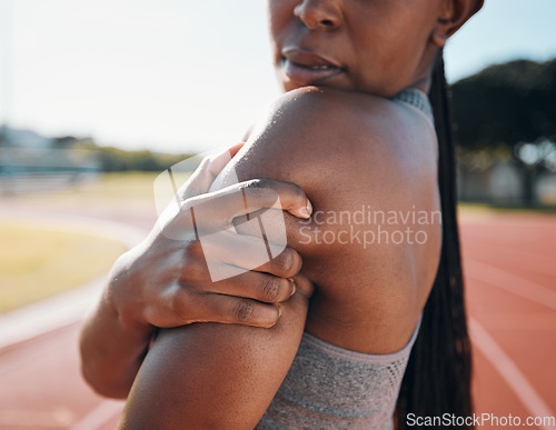 Image of Shoulder pain, fitness and athlete with injury problem in a stadium due to outdoor exercise, training or workout. Hurt, inflammation and person or runner with muscle strain, ache or body tension