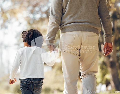 Image of Back, holding hands or kid with a grandfather in park for walking or bonding together family care. Parent, kindness or senior man with a child for support, trust or loyalty in nature garden for love